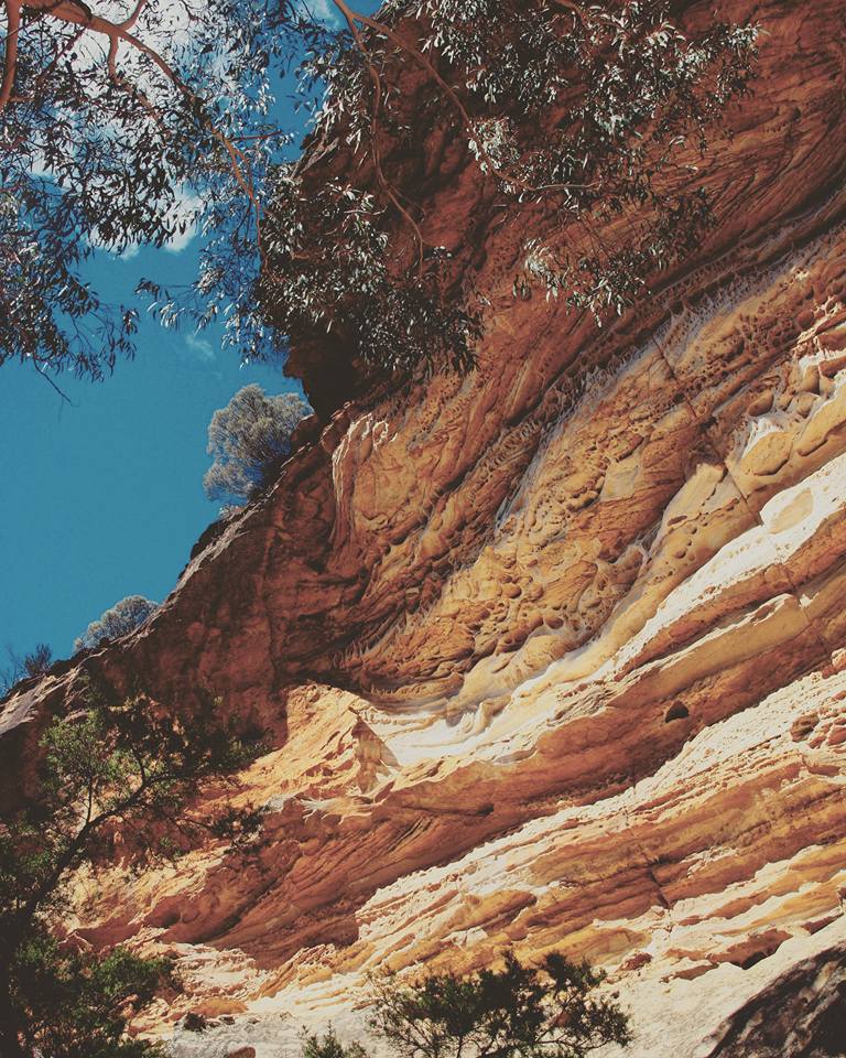 wind eroded cave blue mountains